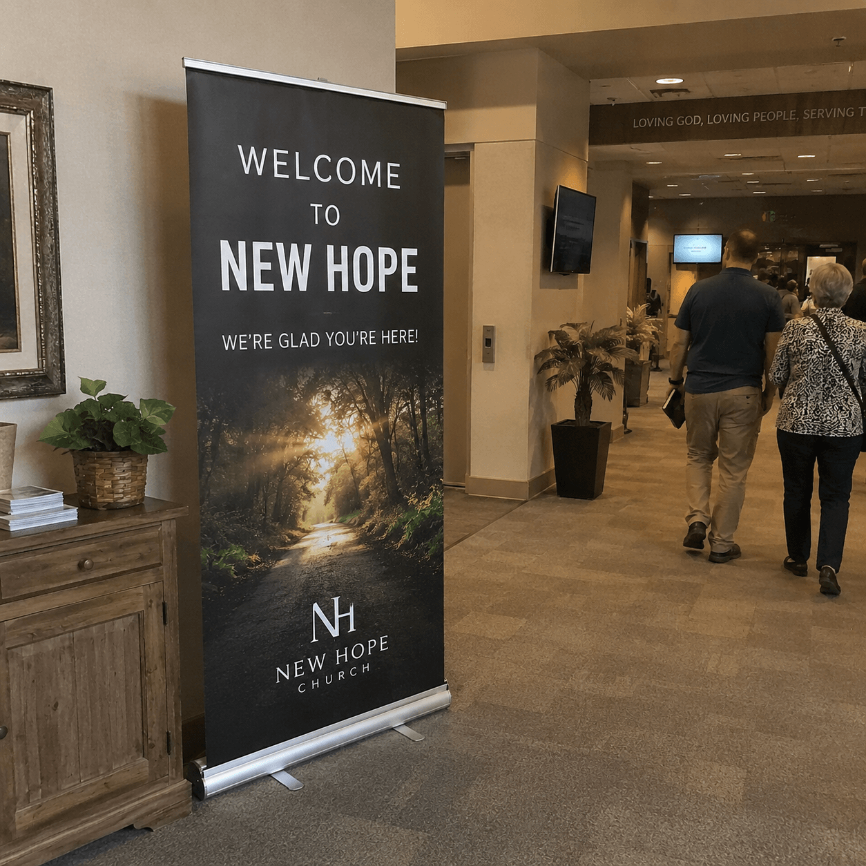 Retractable banner stand displayed inside church lobby welcome area