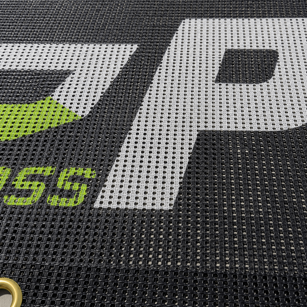 Close-up view of wind-resistant mesh banner material texture