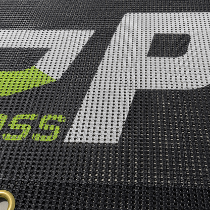 Close-up view of wind-resistant mesh banner material texture