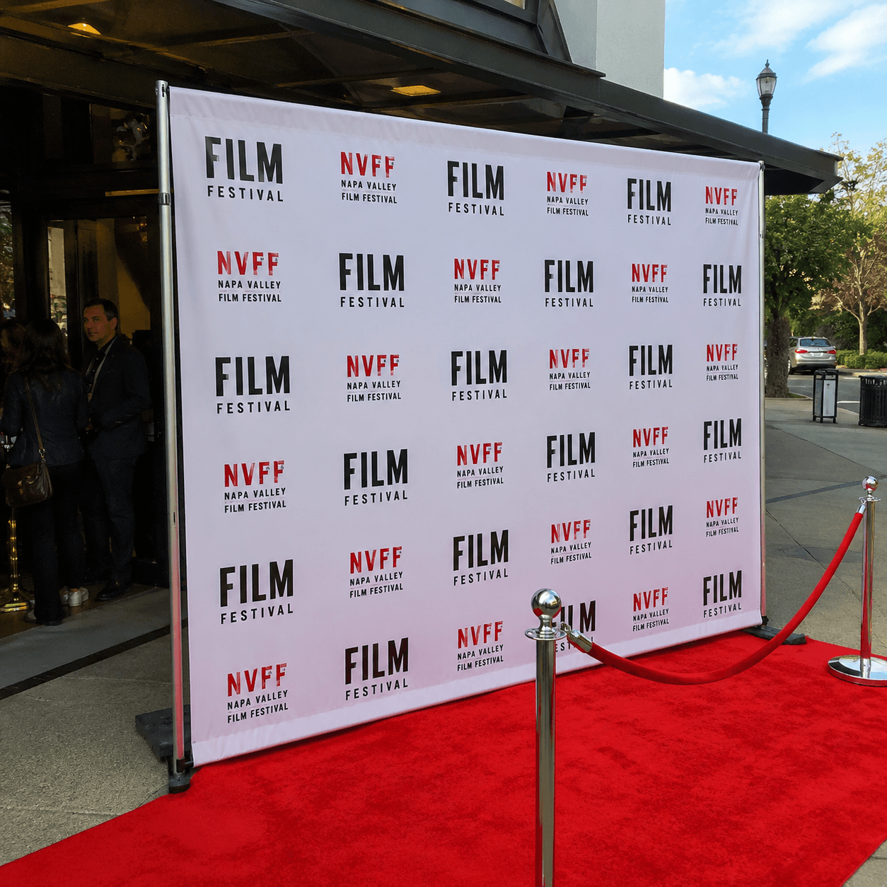 Custom step and repeat banner backdrop at red carpet event entrance