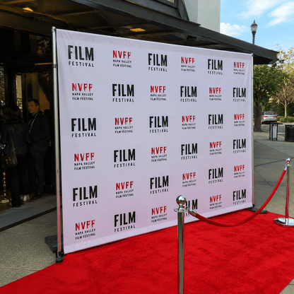 Custom step and repeat banner backdrop at red carpet event entrance