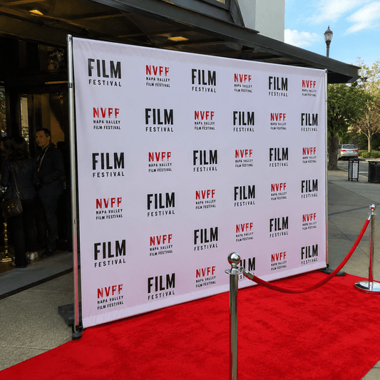 Custom step and repeat banner backdrop at red carpet event entrance