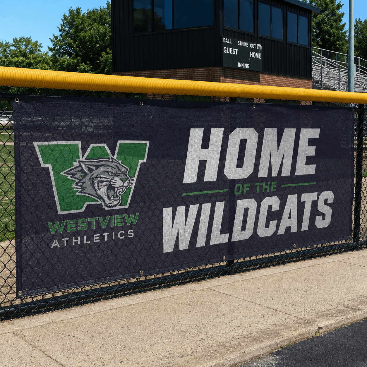 Sports field mesh banner installed on baseball fence