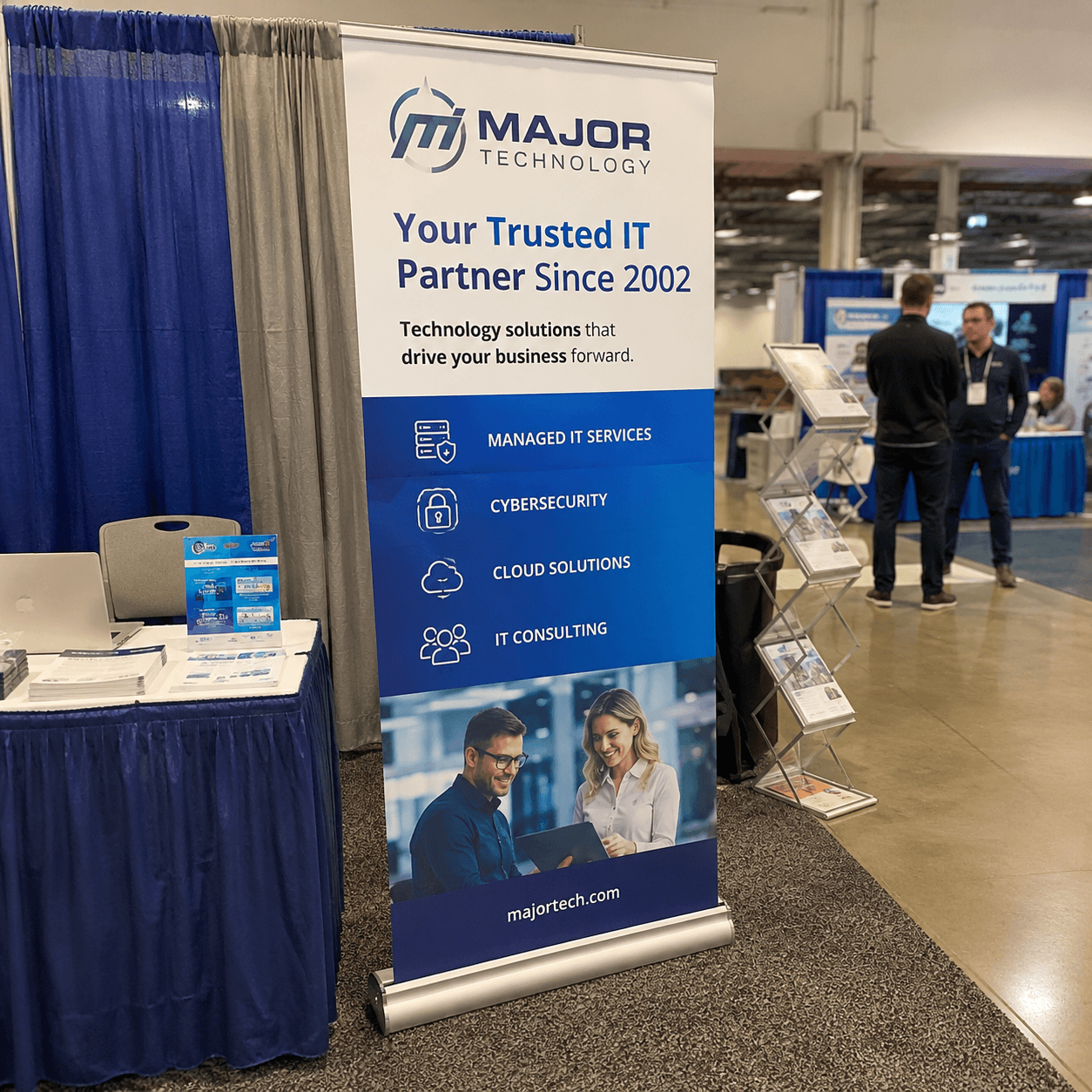 Custom retractable banner stand displayed at a professional trade show booth
