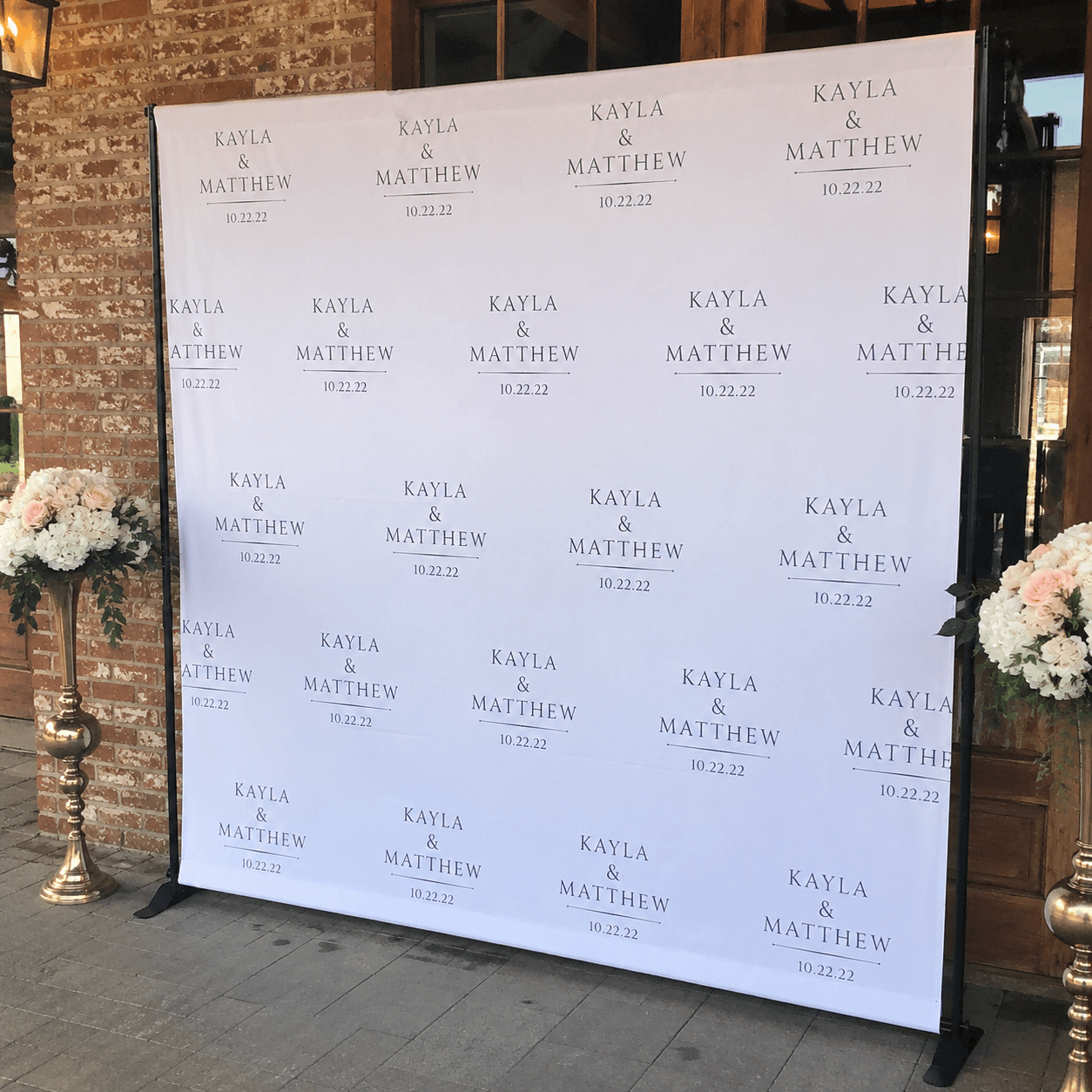Custom step and repeat backdrop used for wedding photography area